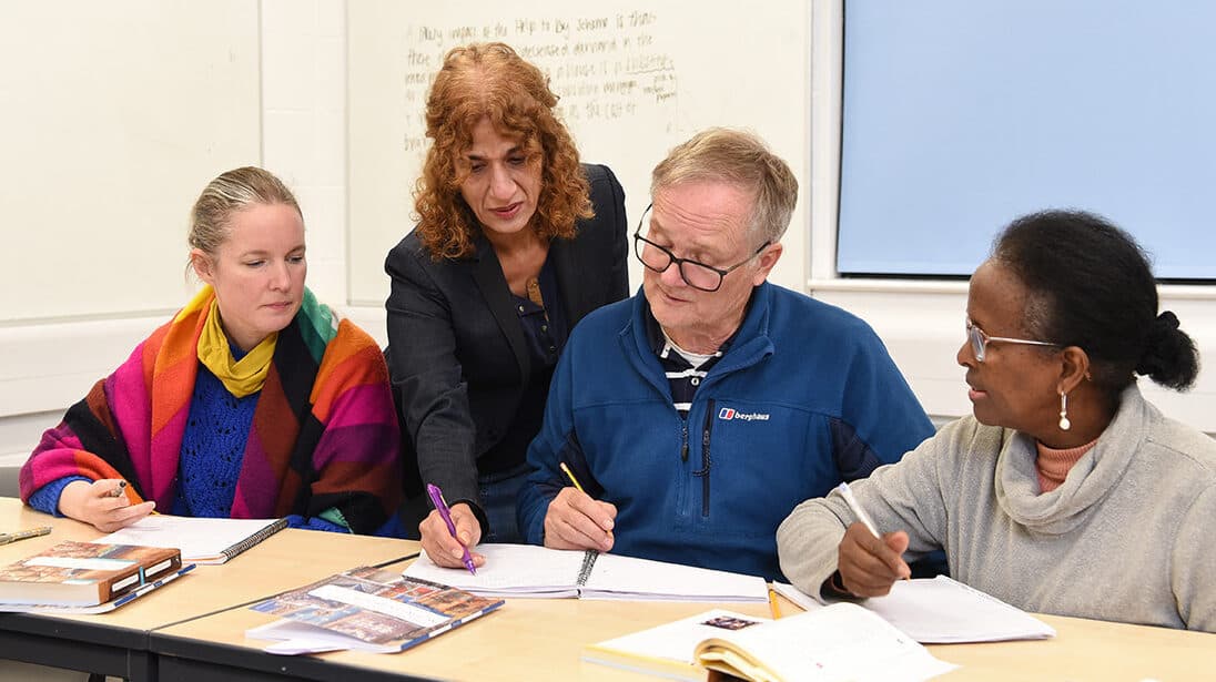 Teacher helping students in Learning Arabic Beginners Level 2