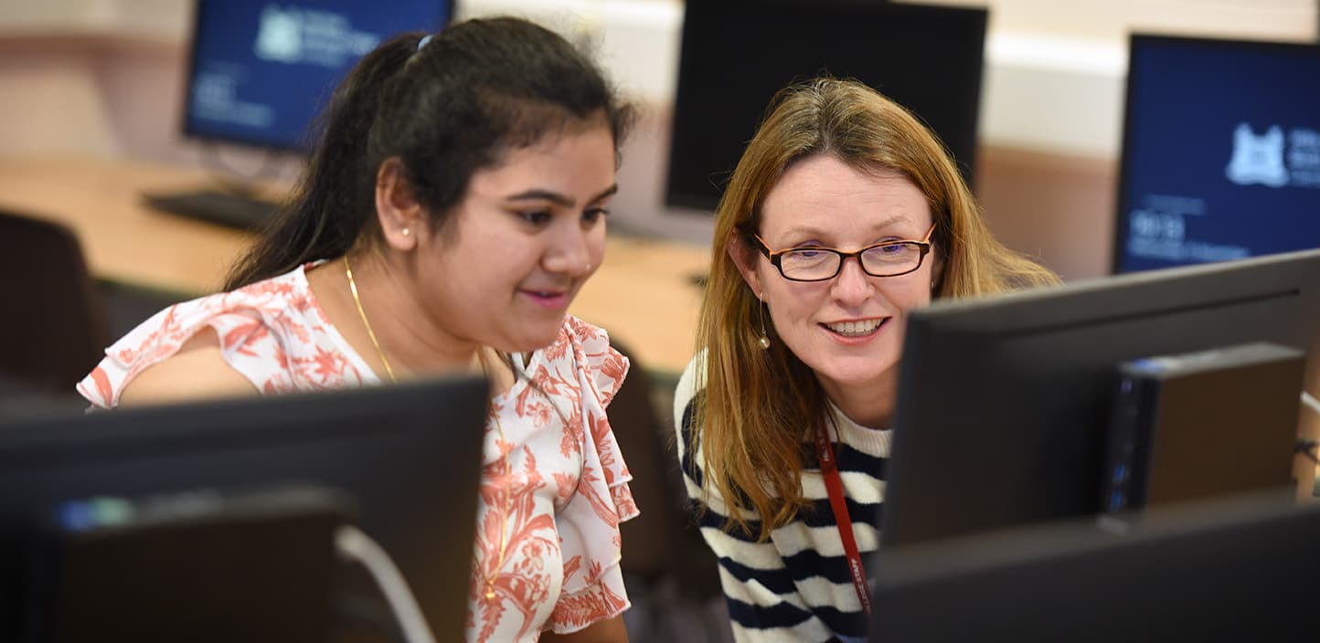 Adult Education students in a graphic design class