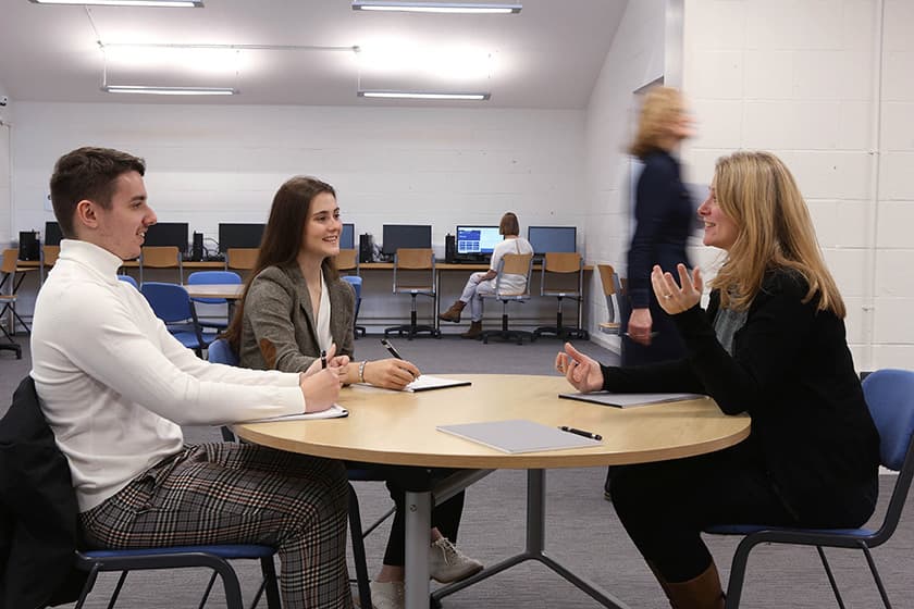 People sitting around a table in the Zone