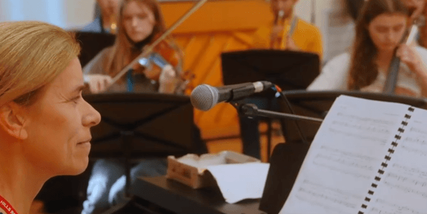 Teacher conducting