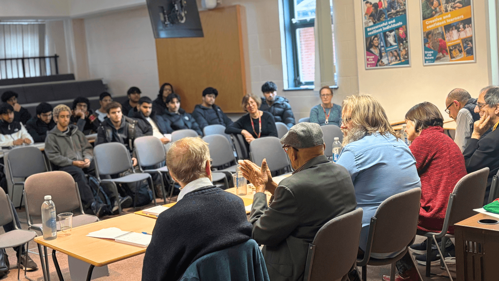 Members of the Interfaith panel speak to an enraptured audience