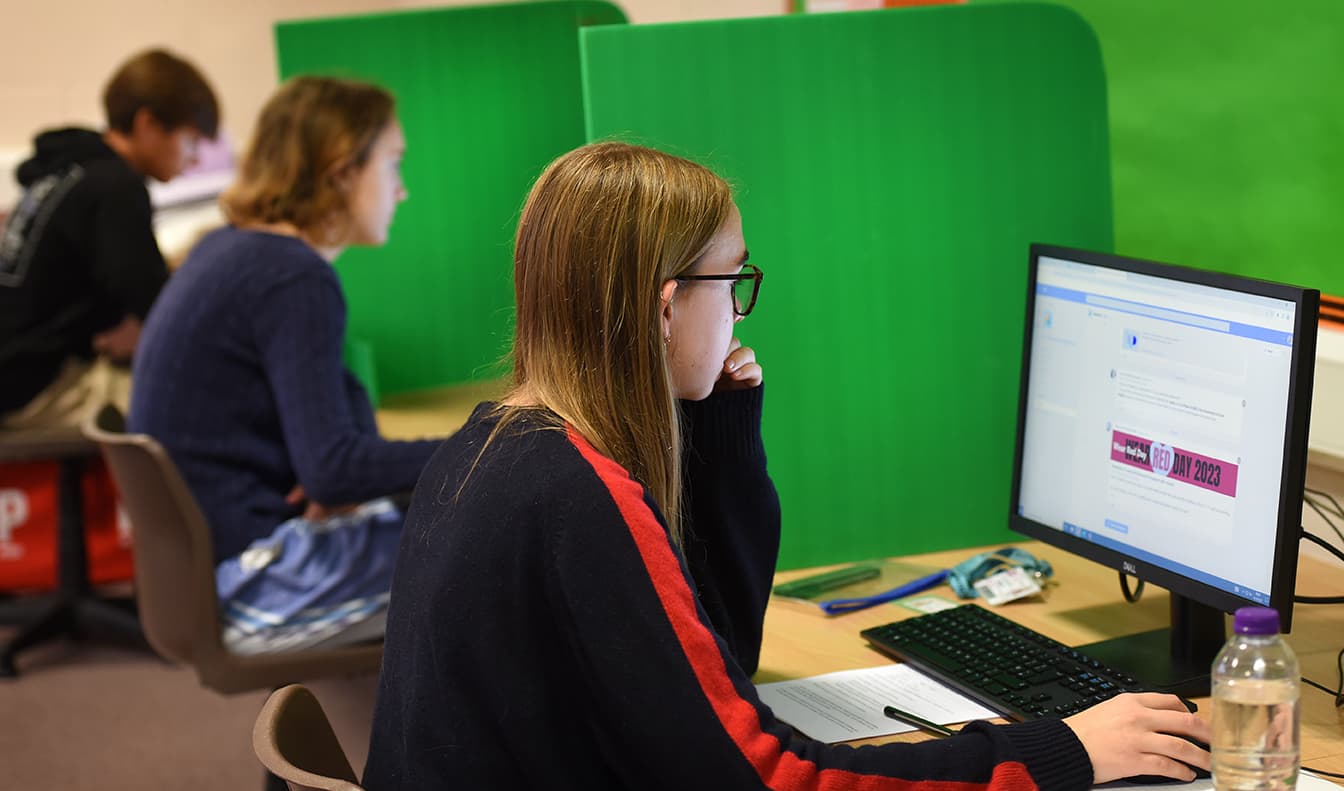 Students sitting an online exam