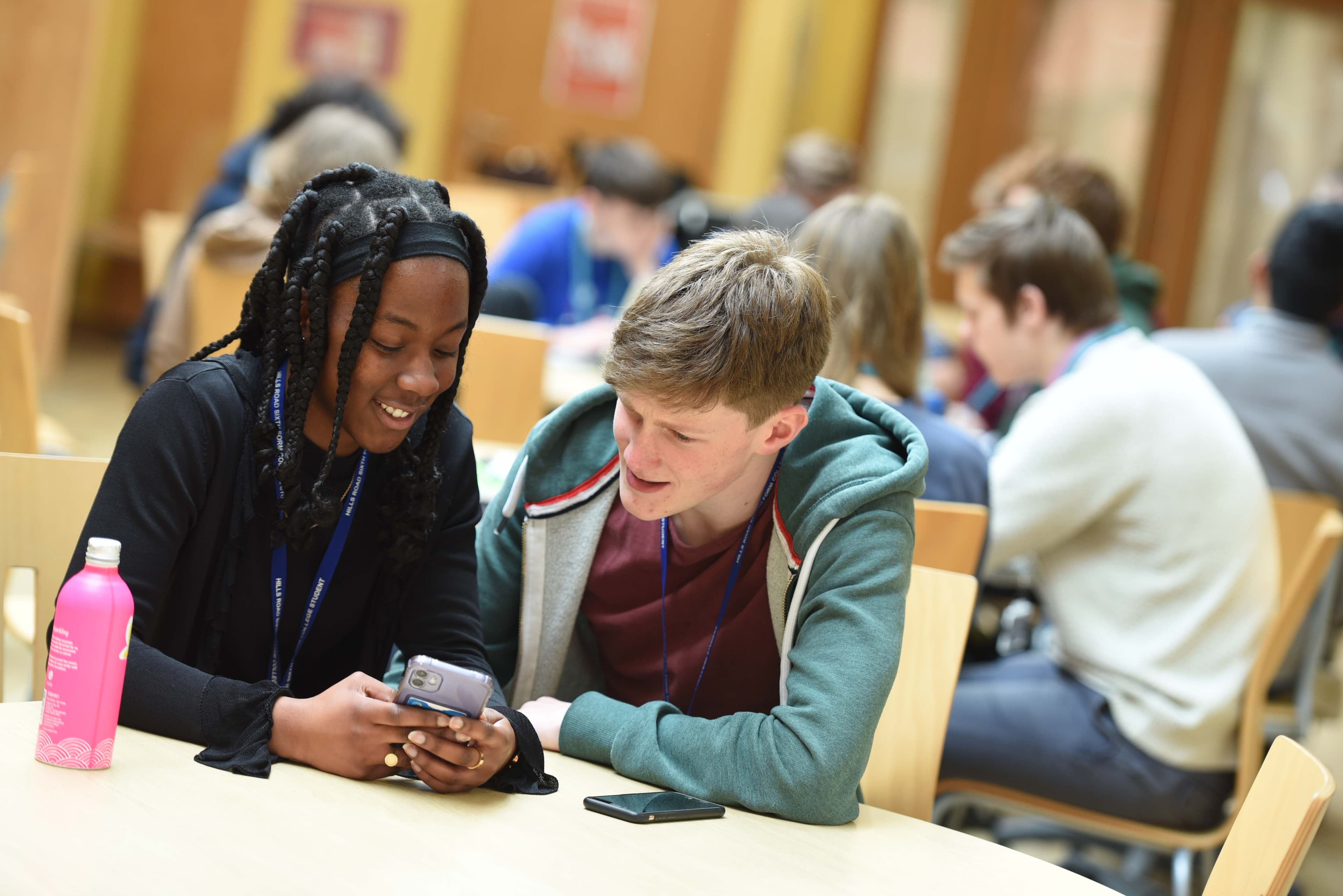 Students looking at a phone