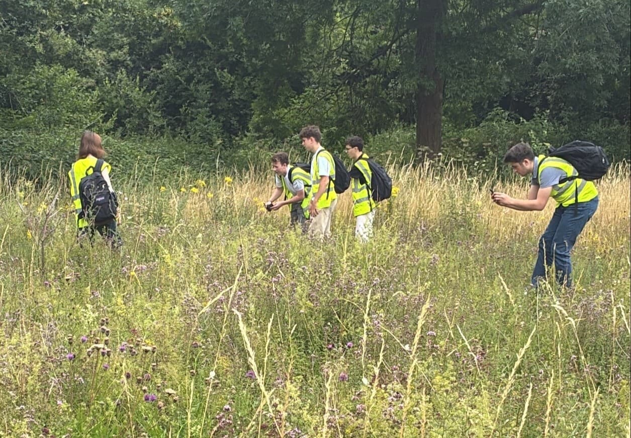 environmental science students grassland survey in trumpington meadows nature reserve