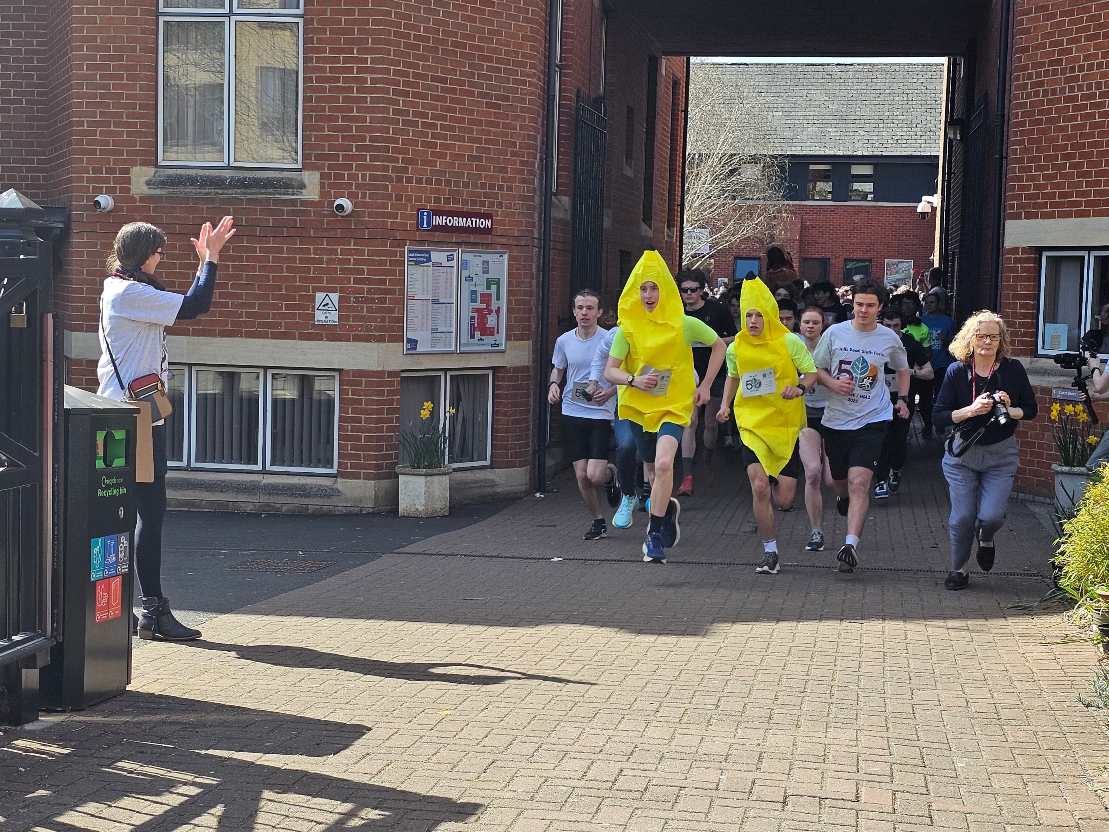 two students lead the pack dressed as bananas  for HR 4.5 fun run 2025