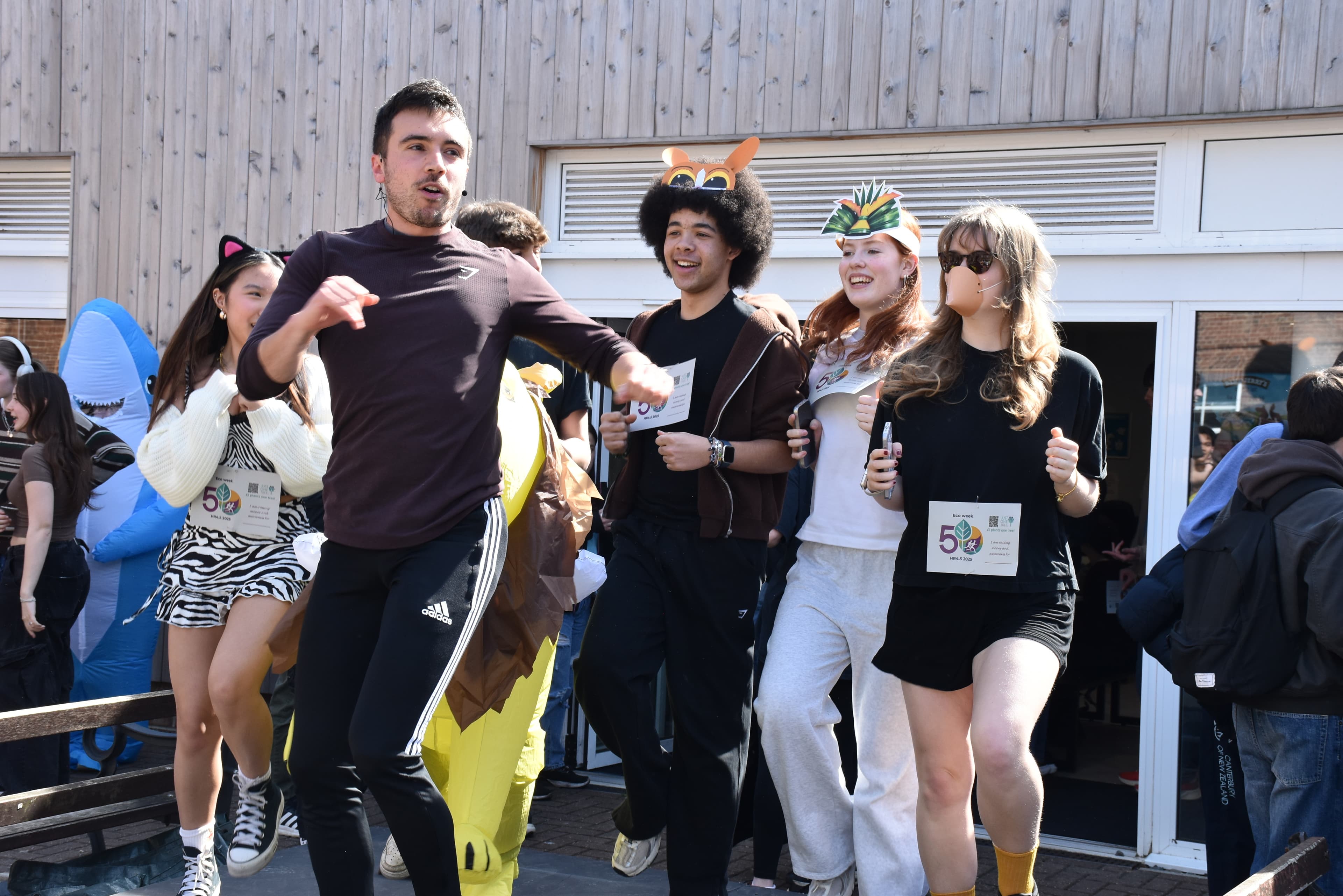 student council members and PT lead warm up for HR 4.5 fun run 2025