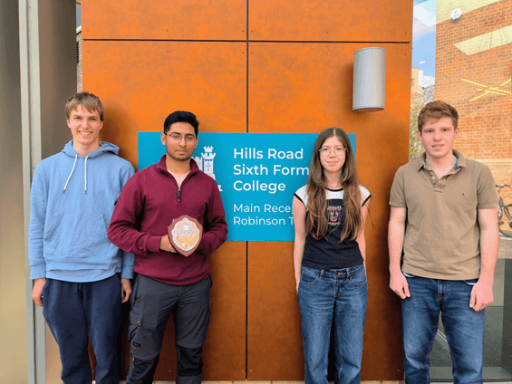 Hills University Challenge Society members with their shield, outside the College