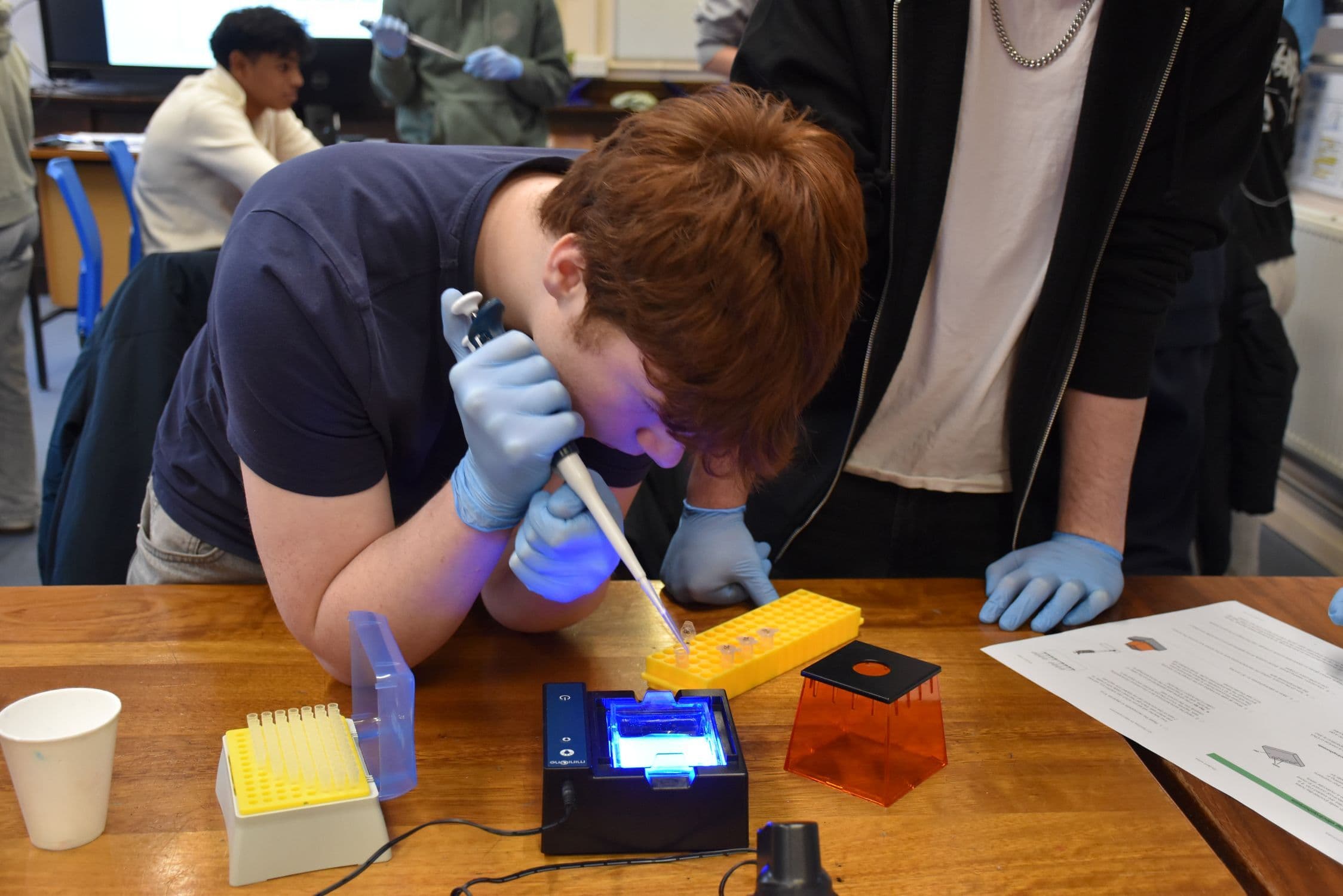 A Biology student using a piece of donated equipment