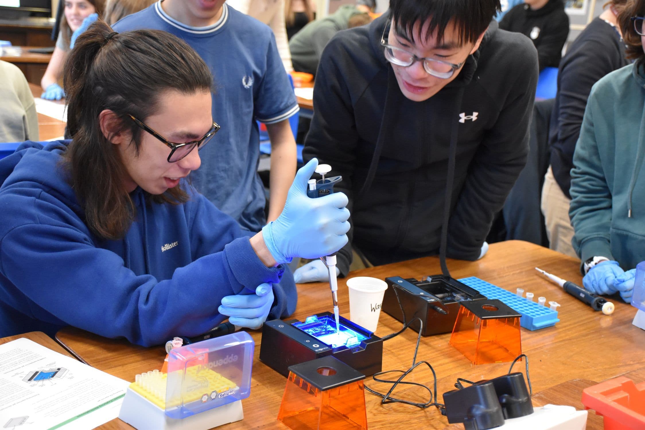 Two students test out the Eppendorf lab equipment