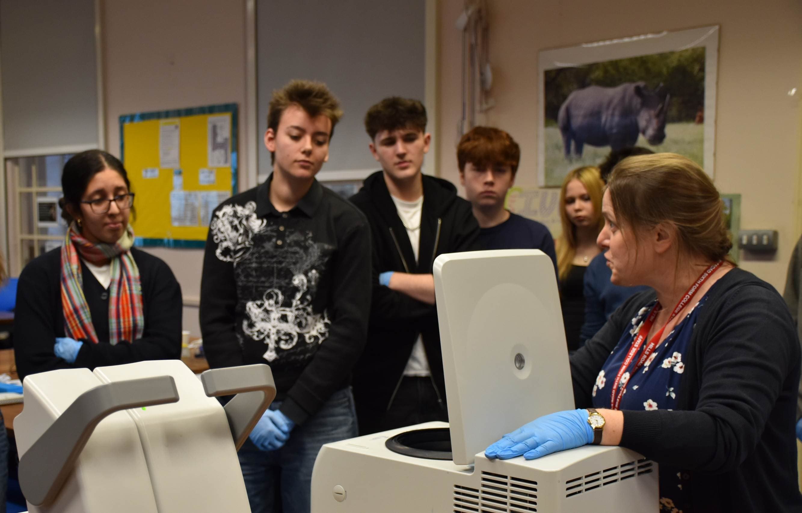 Teacher of Biology, Karen Stephens, shows students the donated temperature-controlled microcentrifuge.