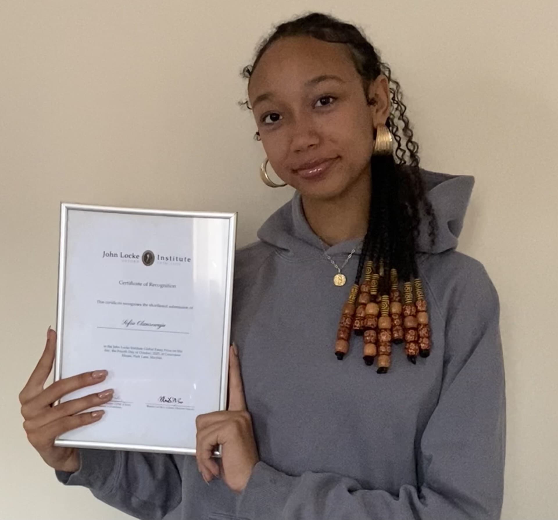 Sofia Olanrewaju with her certificate