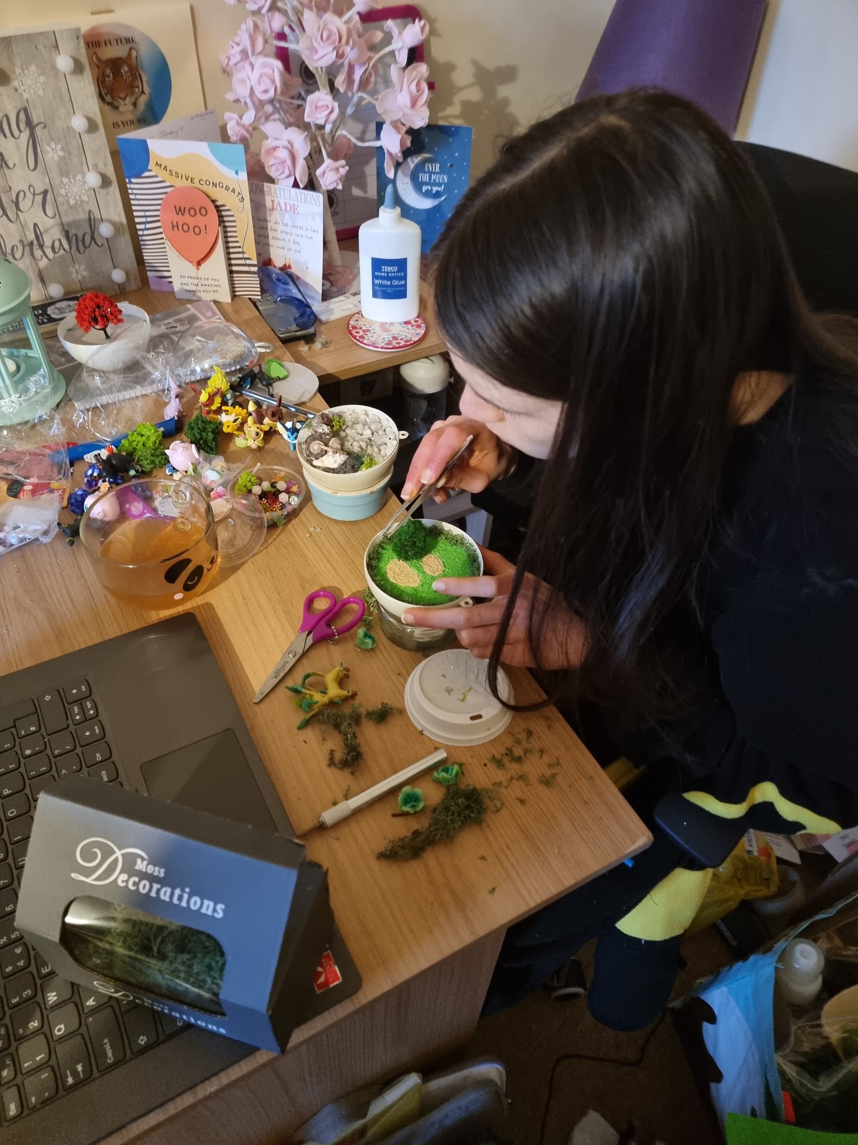 Student making Pokemon terrariums