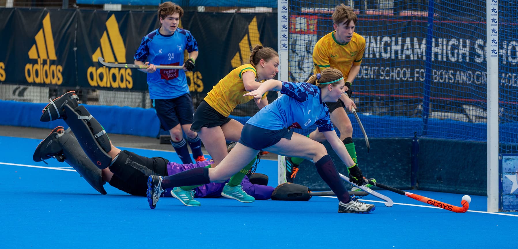 Students playing a hockey match