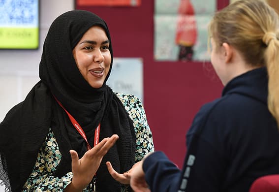 Tutor speaking with a student
