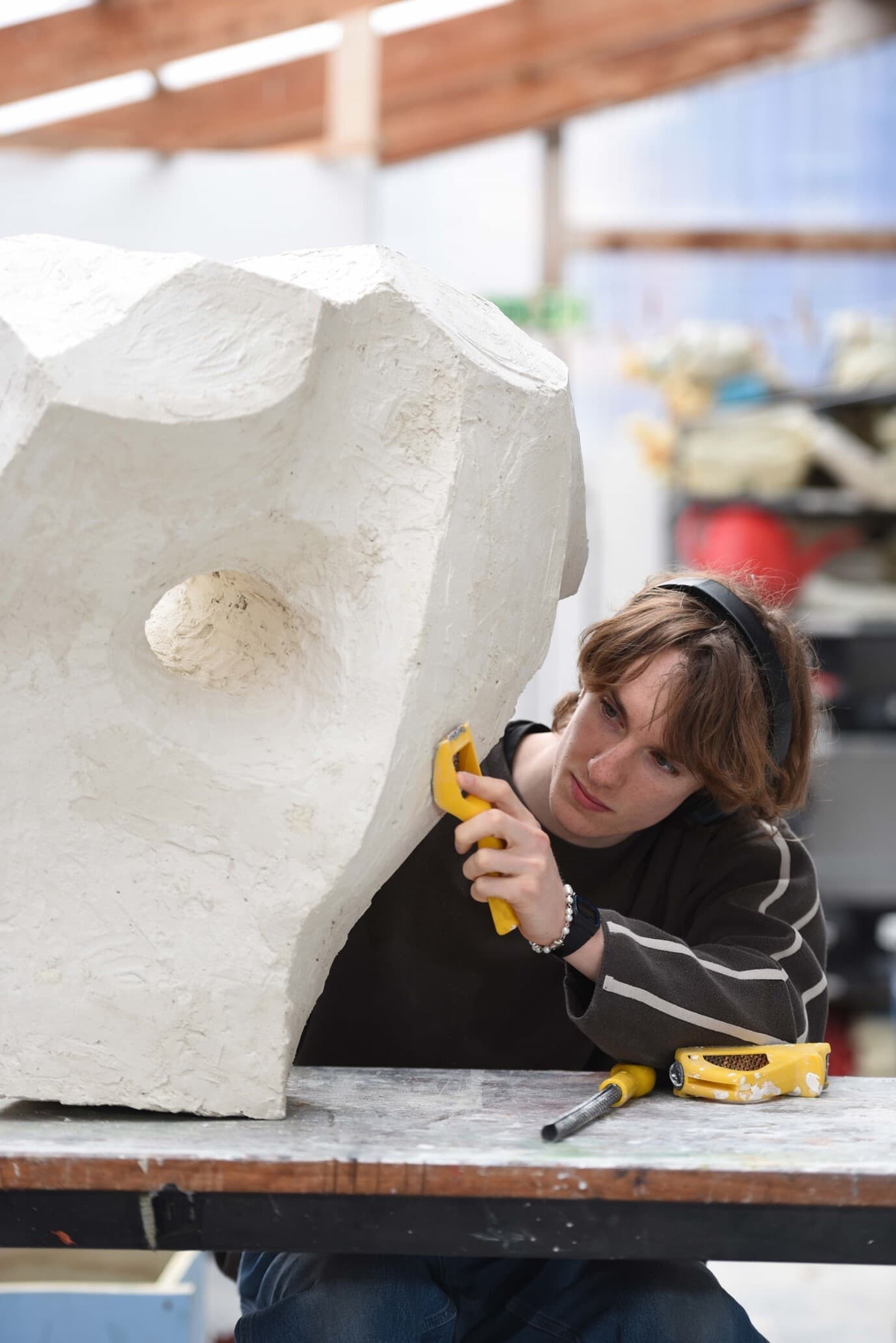 Student working on sculpture