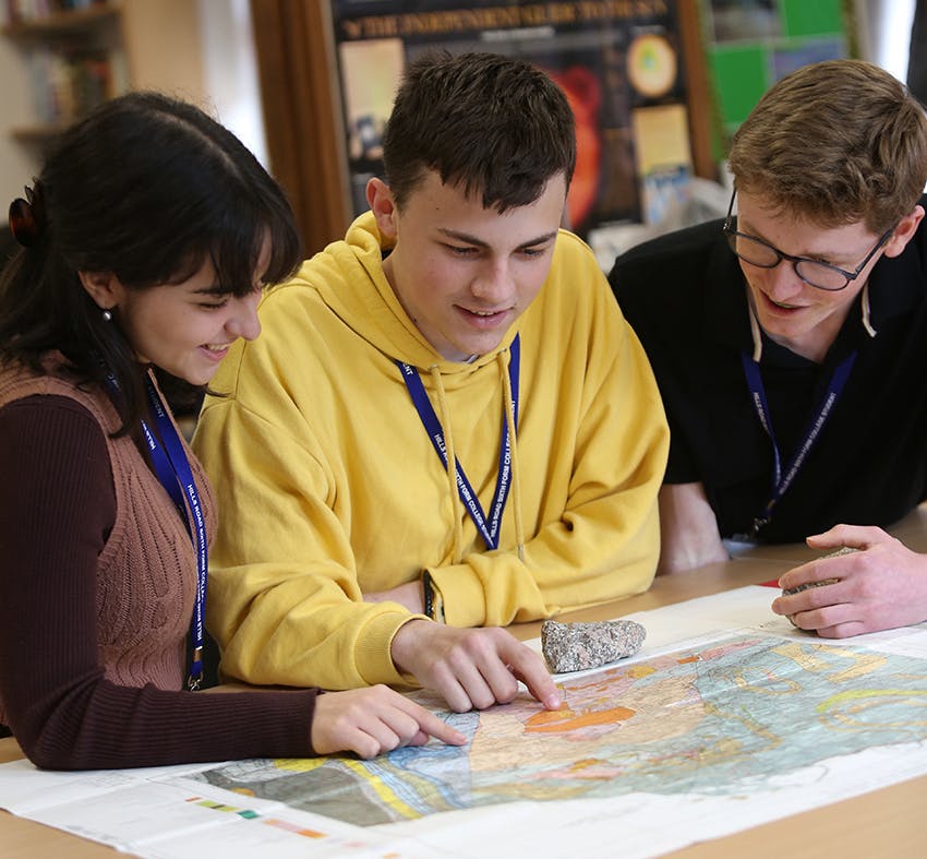 Geology - students looking at a map in class