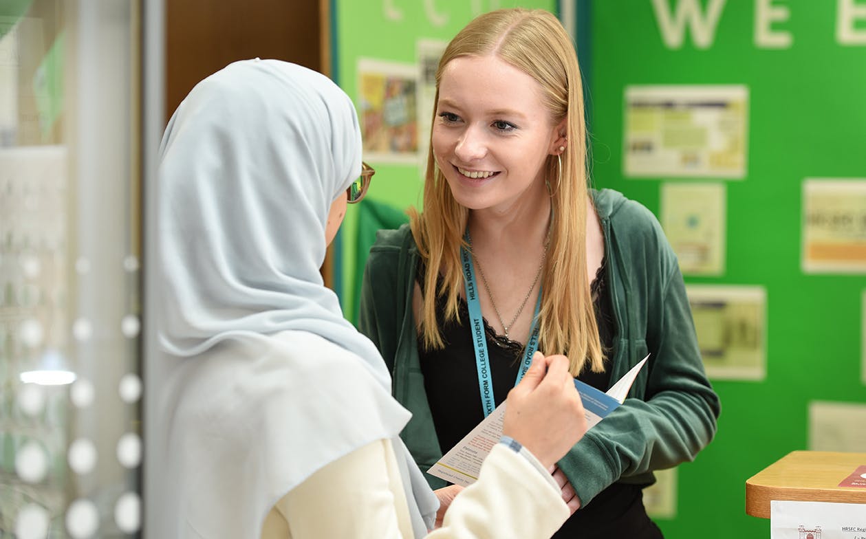 student talking to member of students services team