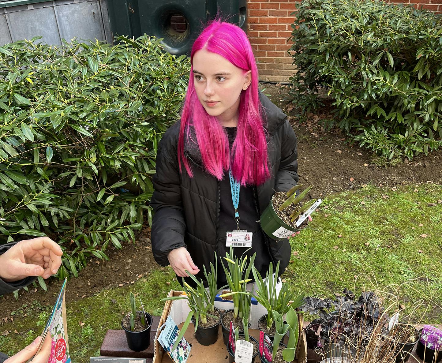 Student taking part in the gardening enrichment activity