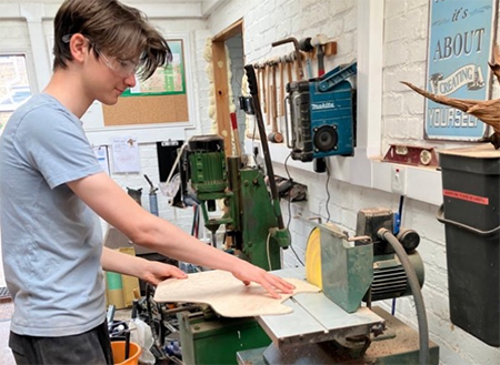 Student making a guitar